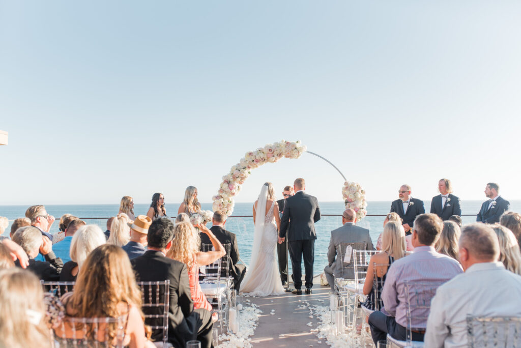 http://westcoastweddingdj.com/wp-content/uploads/2021/08/Laguna-Beach-Wedding-Ceremony.jpg